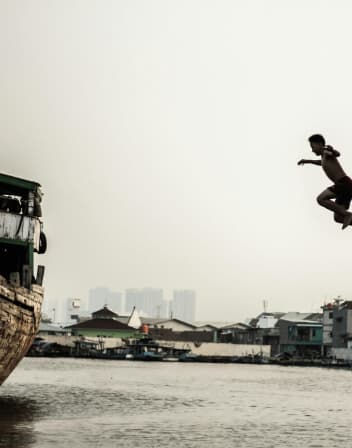 A person diving into the river